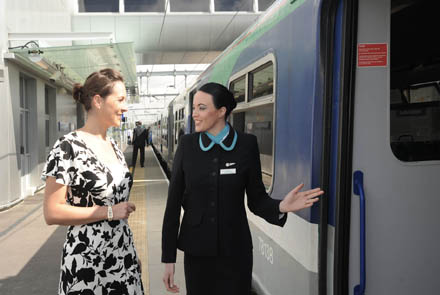 Aer Arann Regional cabin crew member Kerry Crozier pictured helping passenger Emer Kelly from Tramore, Co. Waterford who was in London on Tuesday to celebrate the opening of the London Southend Airport railway station.